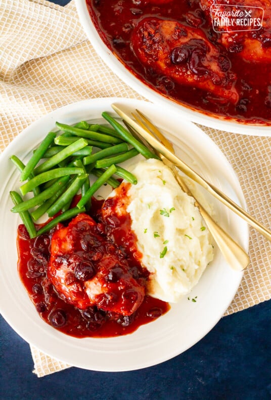 Plate of Cranberry Chicken, green beans and mashed potatoes.