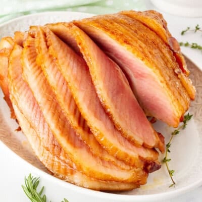 Whole Slow Cooker Spiral Ham cascading layers on a platter.