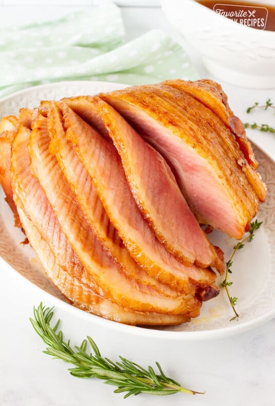 Whole Slow Cooker Spiral Ham cascading layers on a platter.