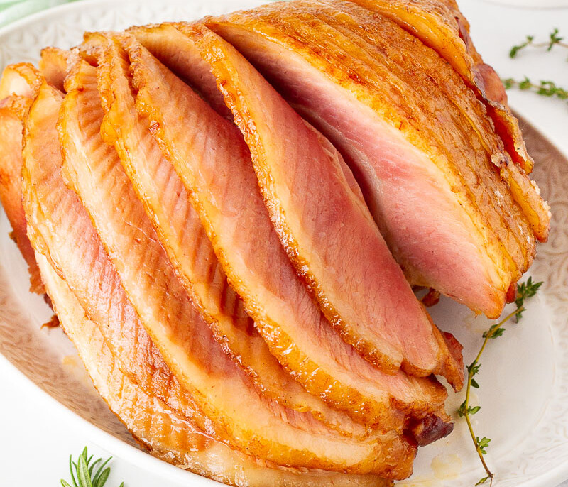 Whole Slow Cooker Spiral Ham cascading layers on a platter.