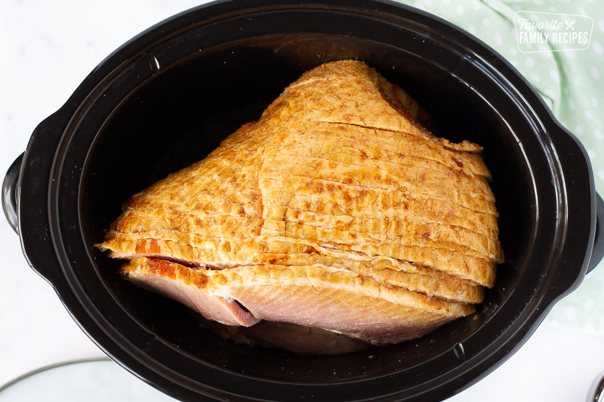 Slow Cooker with a whole Spiral Ham.
