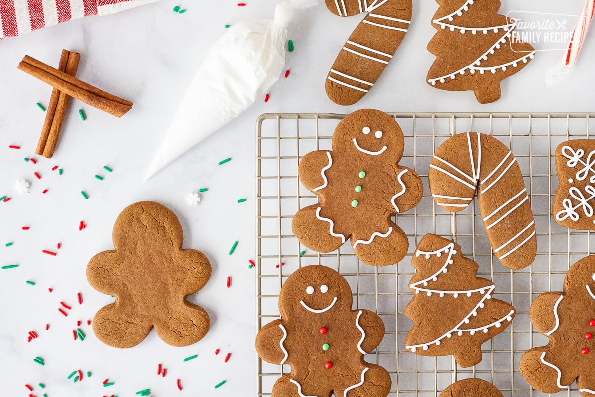 Gingerbread Cookies on a cooling rack next to an undecorated Gingerbread Man.