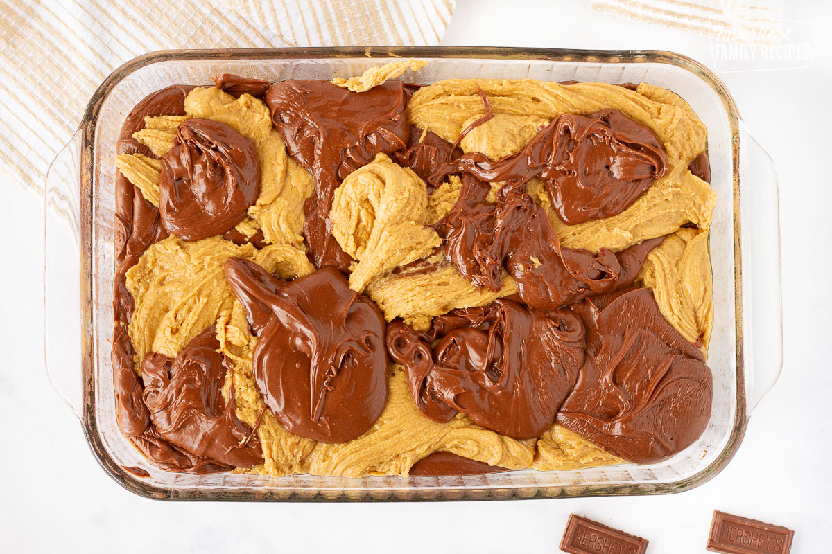 Glass baking dish with dollops of Chocolate and Peanut Butter Fudge.