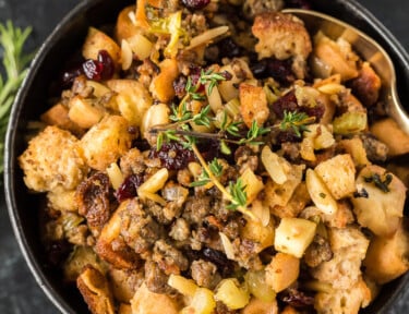 Gluten free stuffing in a black ceramic bowl