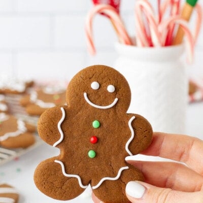 Hand holding a Gingerbread Cookie.