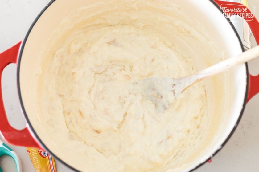 Whipped cream being folded into rice pudding