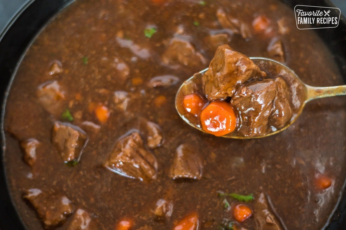 A close-up of a spoonful of beef goulash.