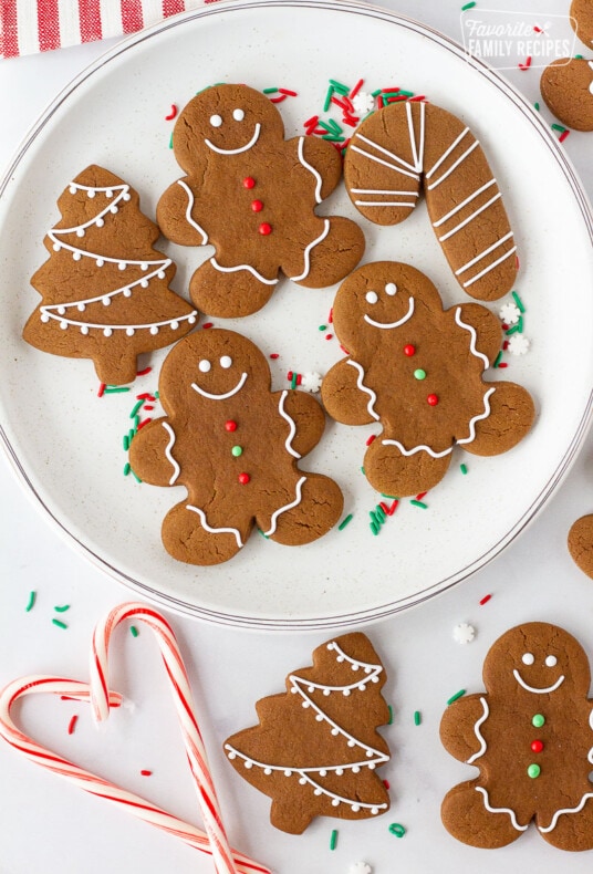 Plate of Gingerbread Cookies with gingerbread men, Christmas trees and candy canes.