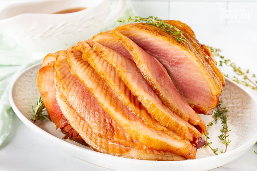 Plated Slow Cooker Spiral Ham with layers cascading forward.