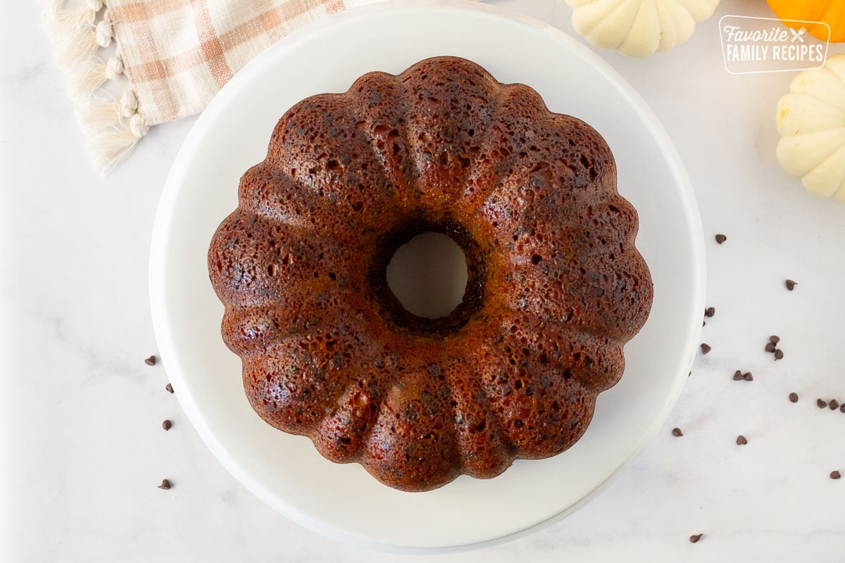 Pumpkin Bundt Cake on a cake plate with no frosting.
