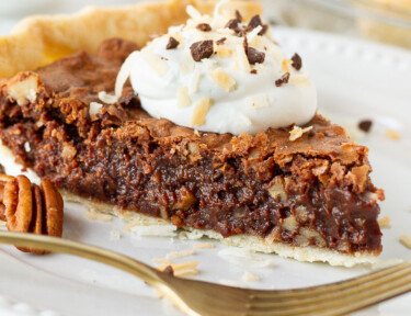 Slice of German Chocolate Pie on a plate with a fork.