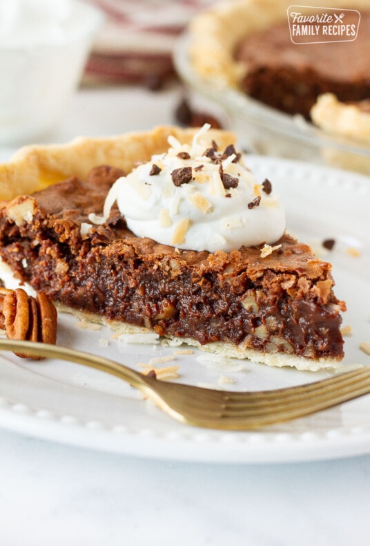 Slice of German Chocolate Pie on a plate with a fork.