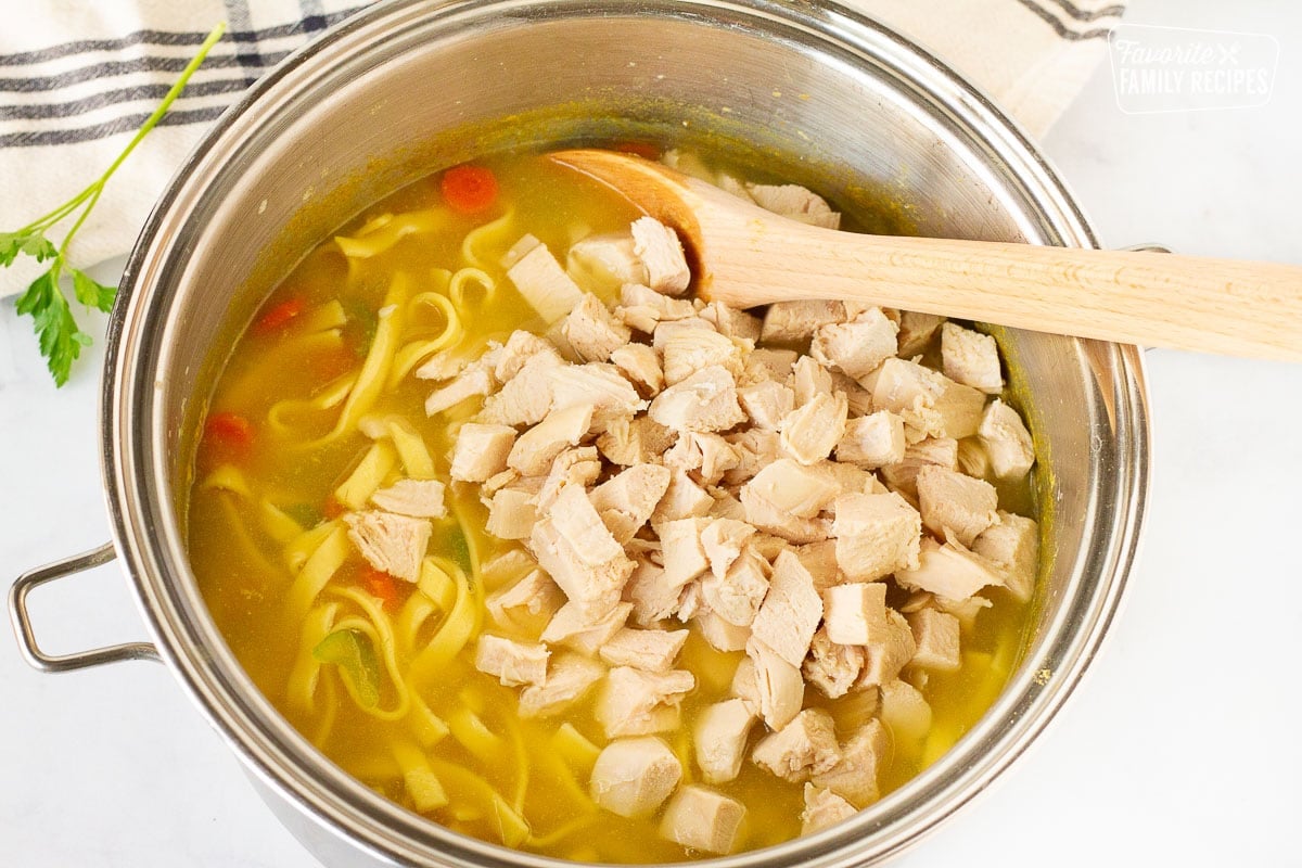 Chicken in a pot for Homemade Chicken Noodle Soup.