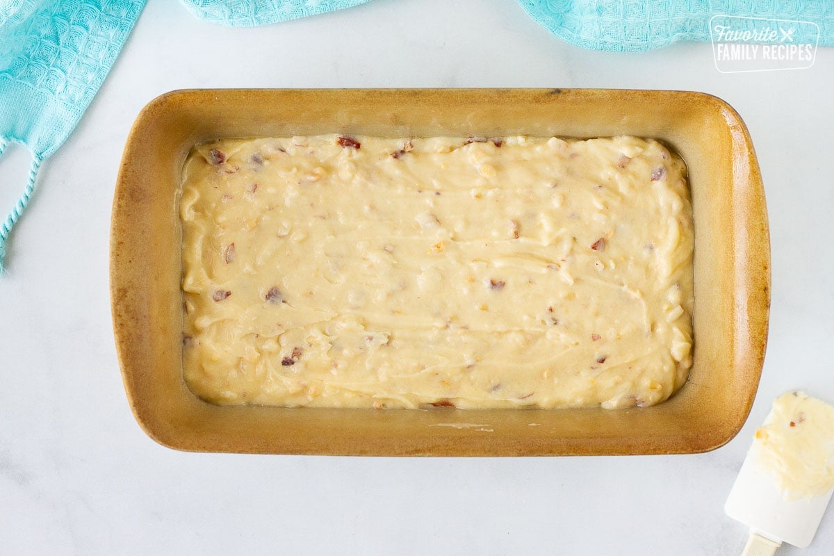 Baking pan full of Sweet Coconut Bread batter.