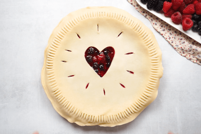 Top pie crust added to berry mixture for Easy Berry Pie.