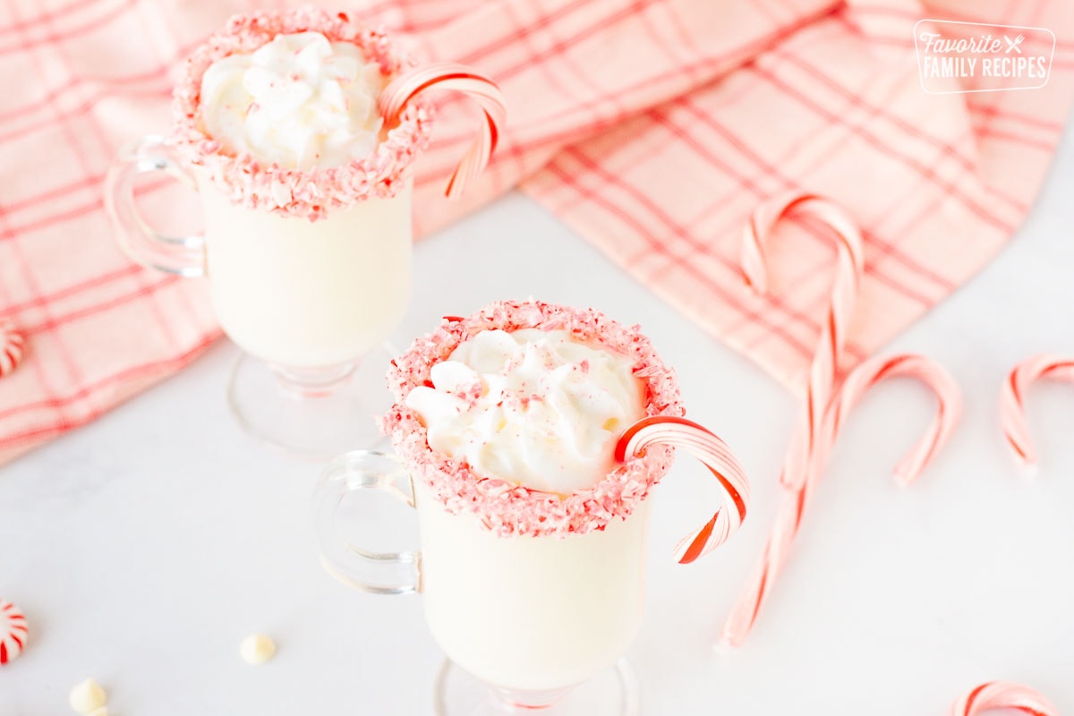 Mugs of Peppermint Hot Chocolate with candy cane rims.