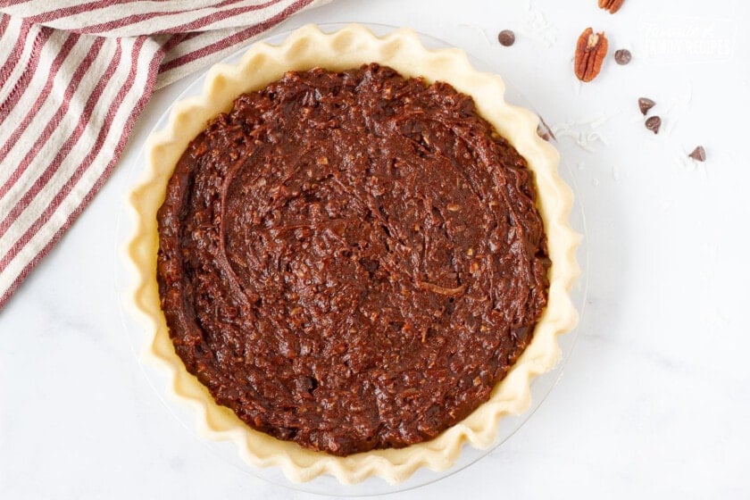 Unbaked German Chocolate Pie in a glass pie plate.