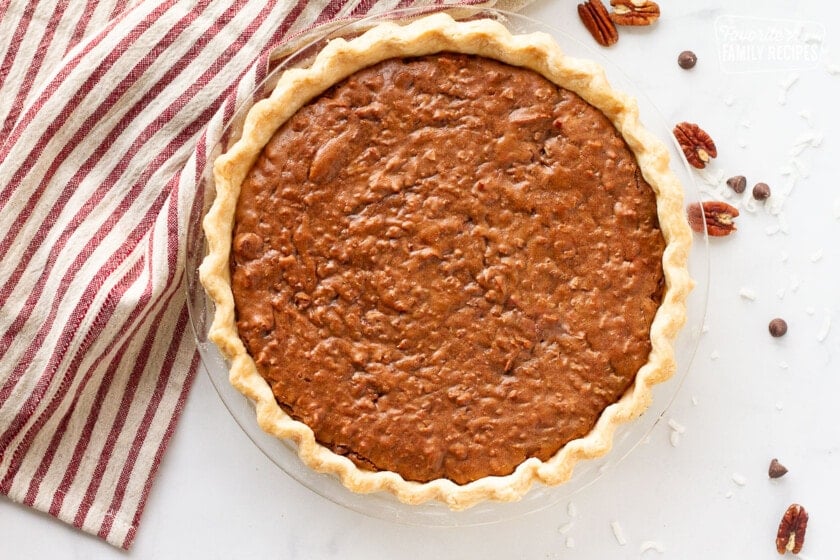 Baked German Chocolate Pie in a clear glass pie plate.