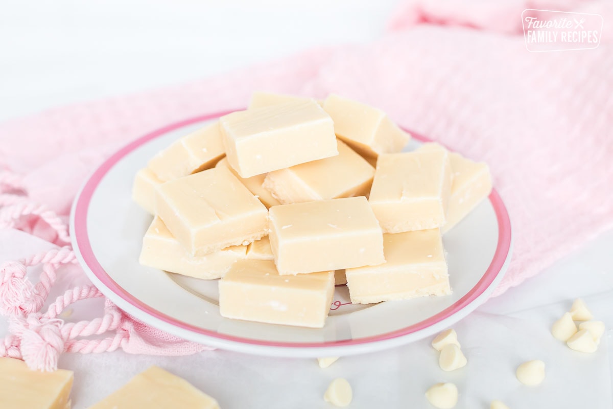 Pieces of white fudge on a plate.