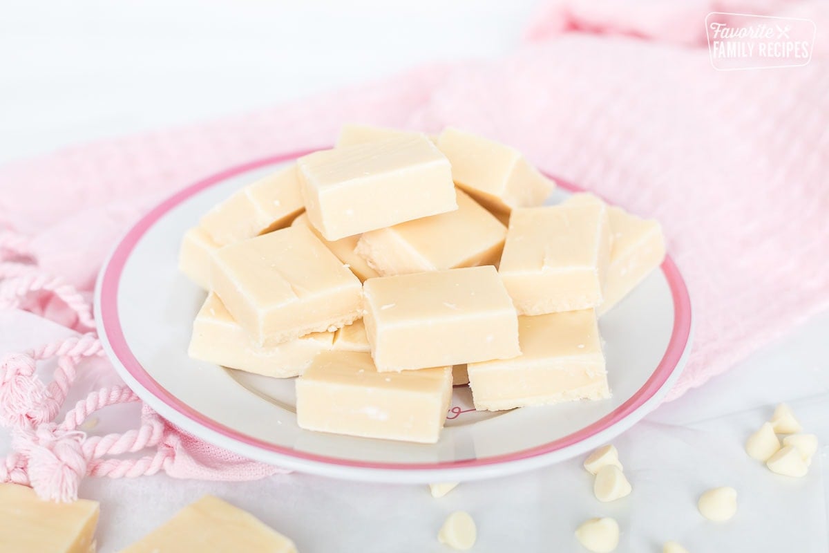 Pieces of white fudge on a plate.