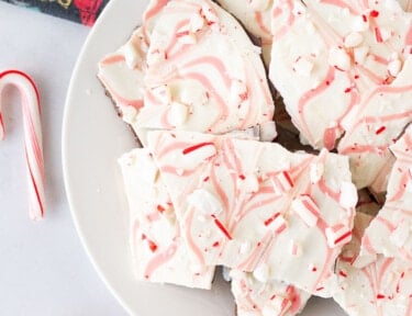 Plate of Peppermint Bark with crushed candy canes on top.