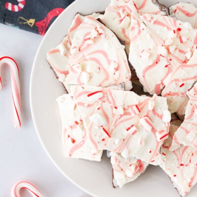 Plate of Peppermint Bark with crushed candy canes on top.