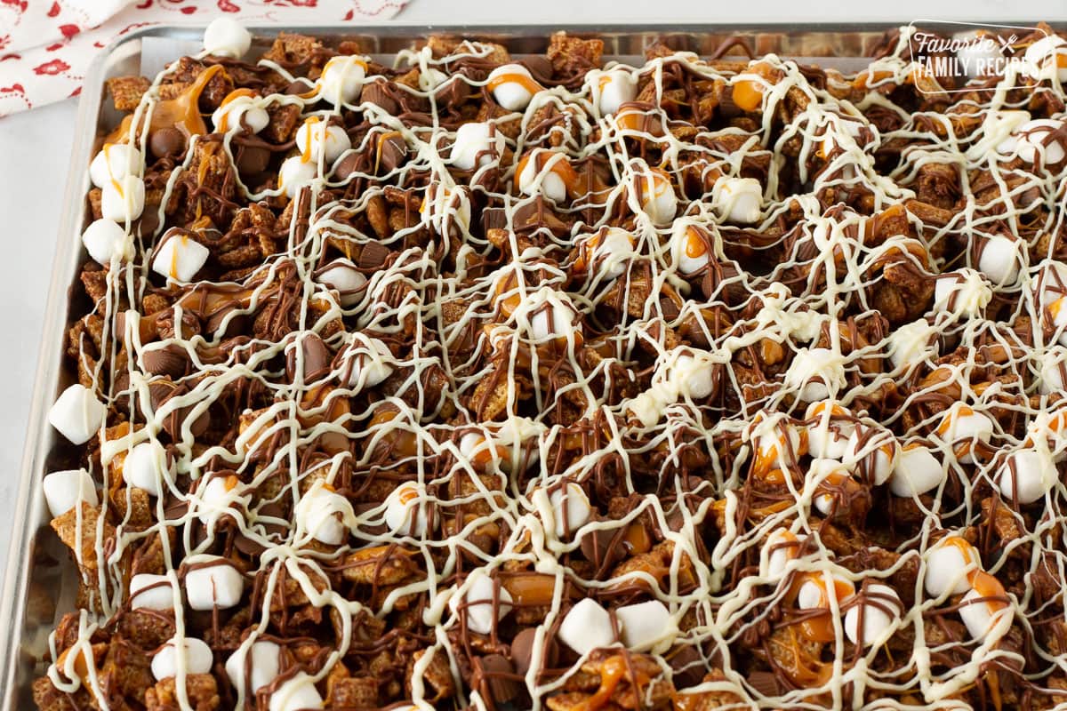 Chocolate drizzled on top of Sweet Chex Mix.