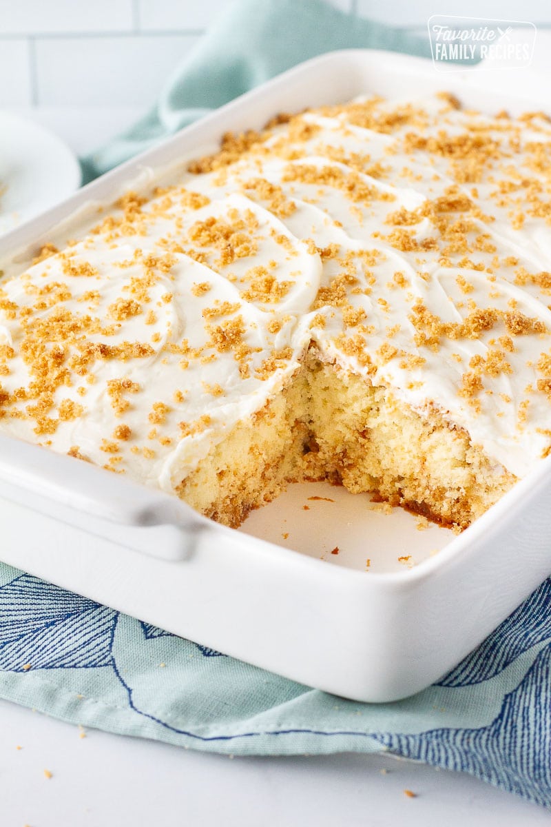 Baking dish with a slice of Cinnamon Roll Cake missing.