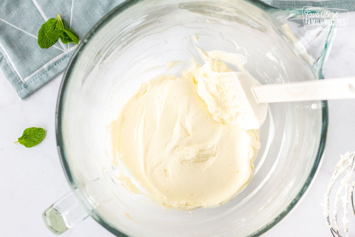 Mixing bowl of whipped cream cheese and mint extract for Butter Mints.