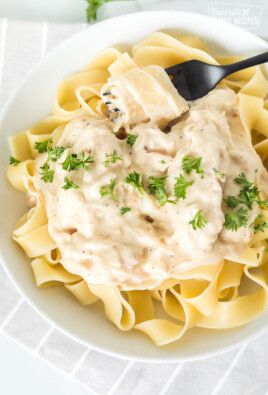 A bowl of Crockpot chicken Alfredo with pasta noodles
