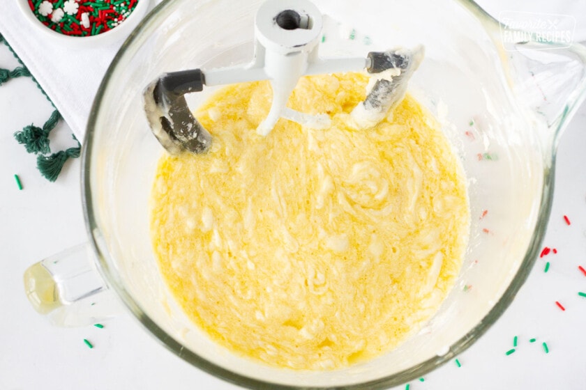 Mixing bowl of eggs, butter and sugar for Christmas Sugar Cookies.
