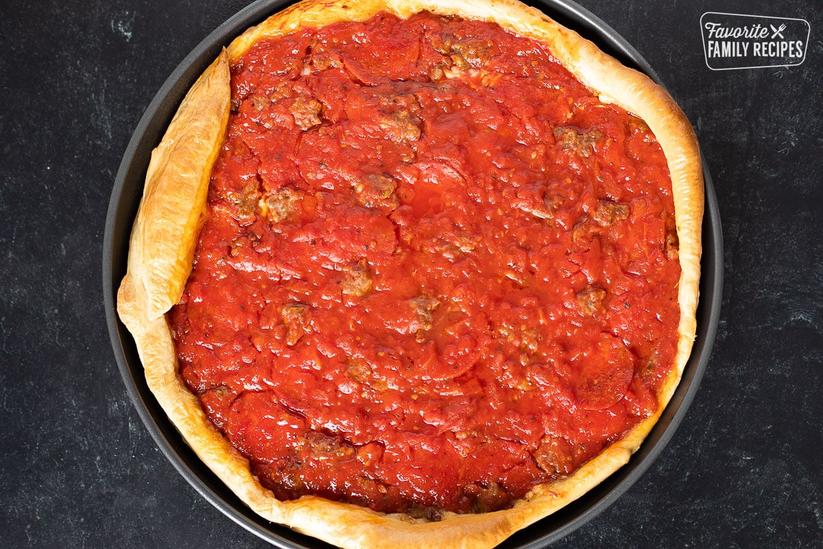 A cooked copycat of a Gino's East pizza in a deep dish pan