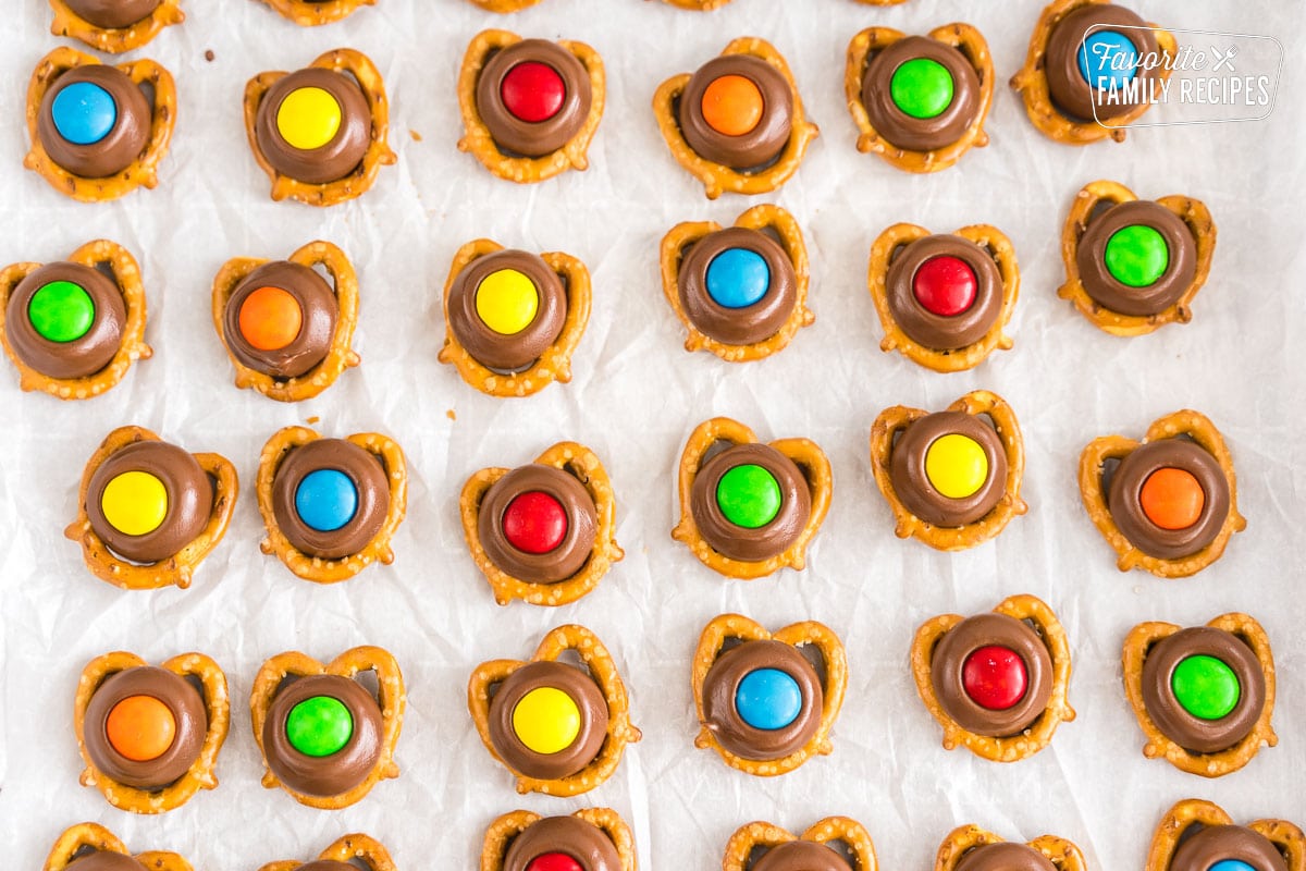 Hershey Kiss Pretzels on a baking sheet.