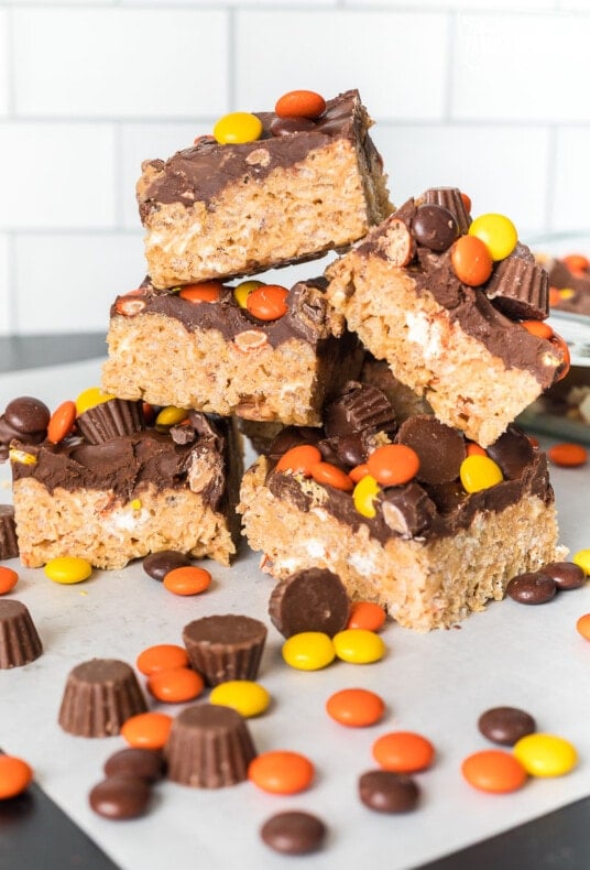 Peanut Butter Rice Krispie Treats stacked on a table top