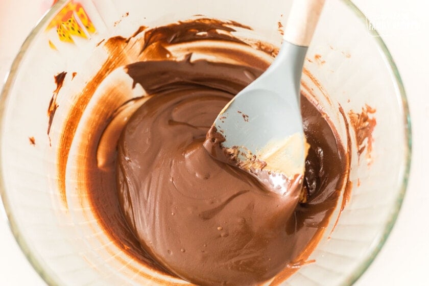 Peanut butter, chocolate chips, and peanut butter chips melted together in a bowl