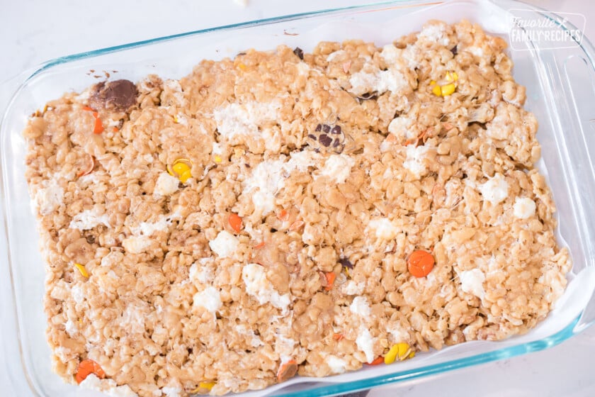 Peanut Butter Rice Krispie Treats pressed into a glass pan