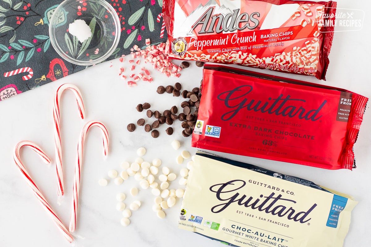 Andes peppermint crunch chips, Guittard extra dark chocolate chips, Guittard white chocolate chips, candy canes and coconut oil to make Peppermint Bark.