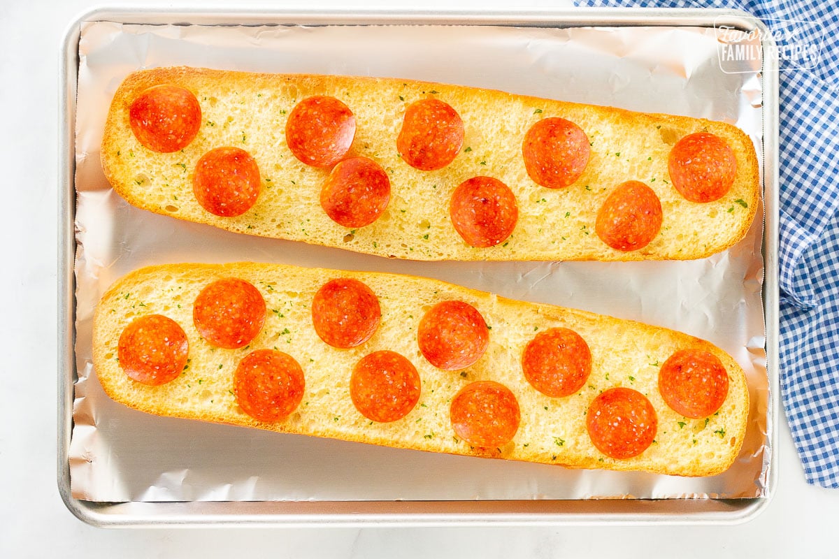 Pepperoni on toasted butter French bread for pizza.
