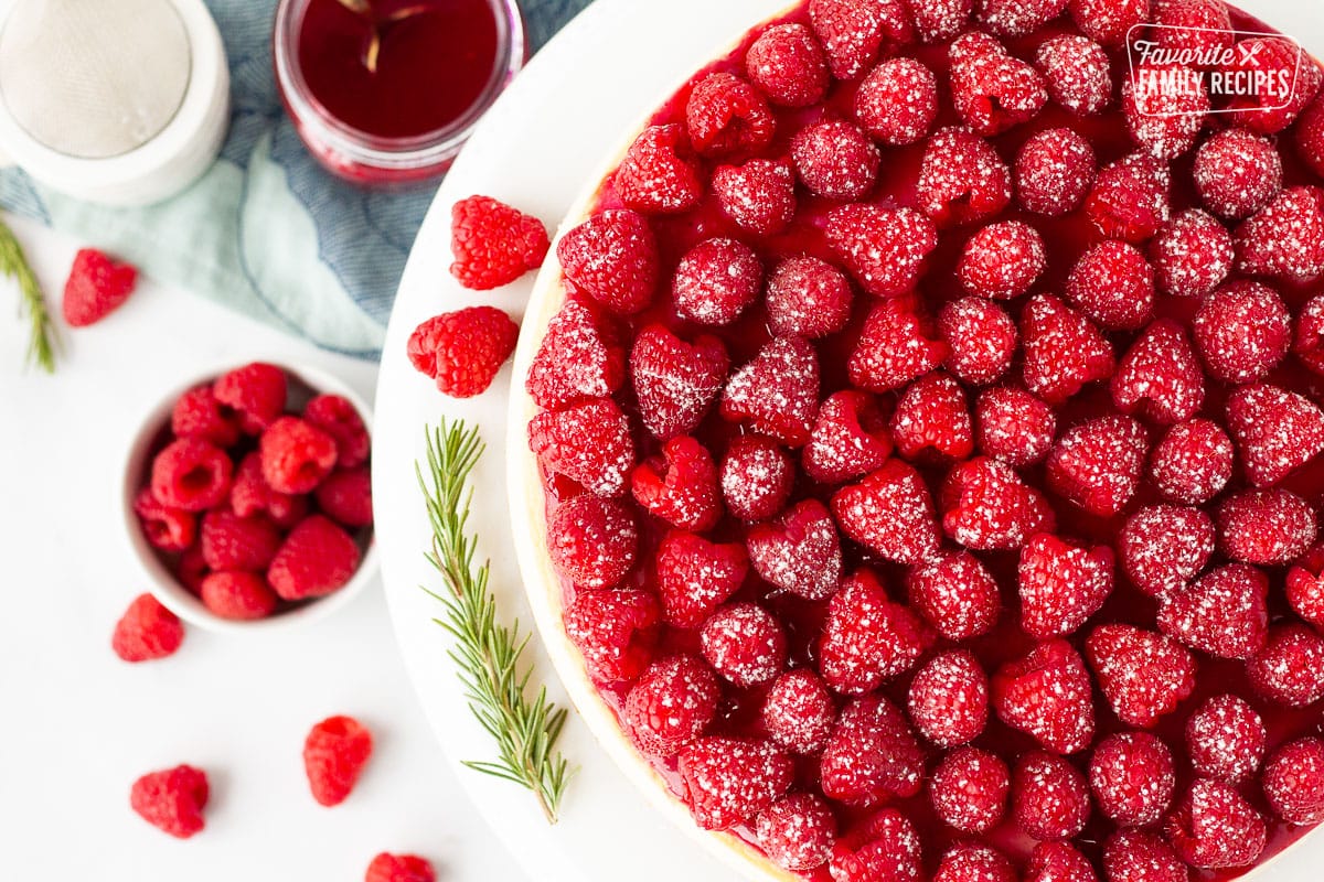 Close up of Raspberry Cheesecake with fresh raspberries.