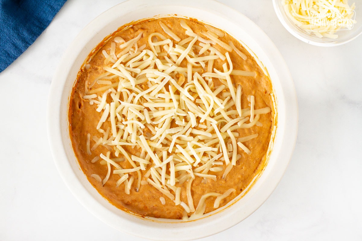 Cheese on top of Restaurant Style Refried Beans.