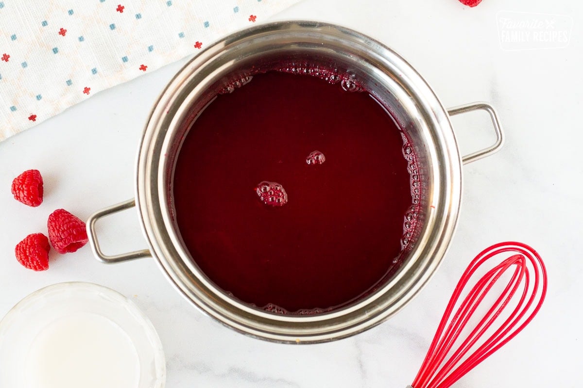 Pot of thin raspberry coulis. Cornstarch slurry on the side.