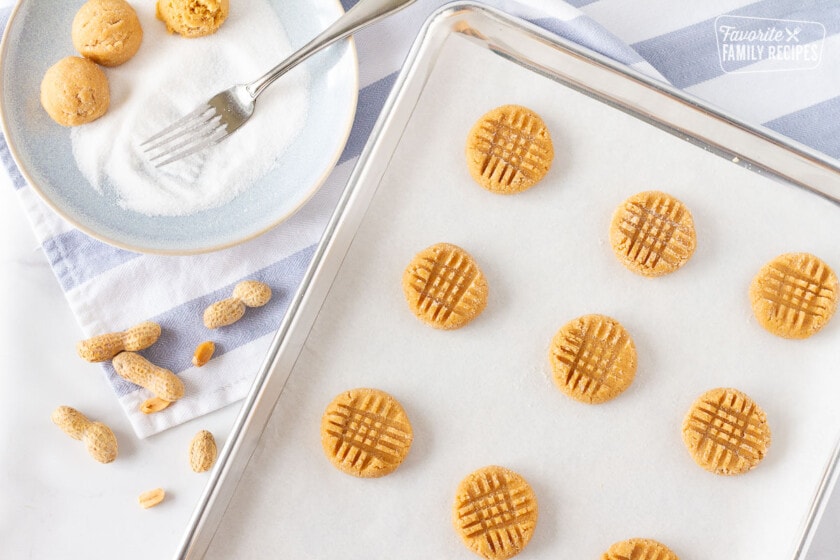 Cookie sheet with unbaked Peanut Butter Cookies.