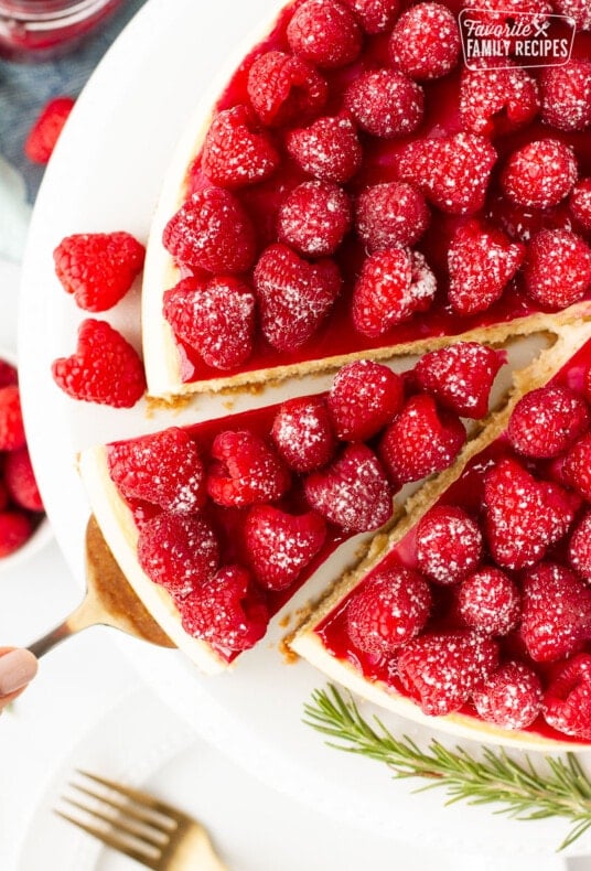 Top view of Raspberry Cheesecake with a slice coming out.