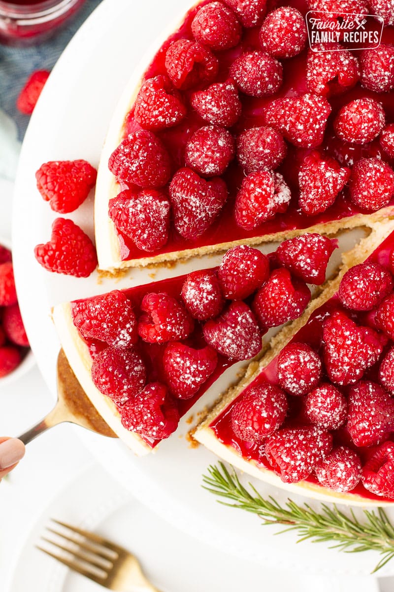 Top view of Raspberry Cheesecake with a slice coming out.