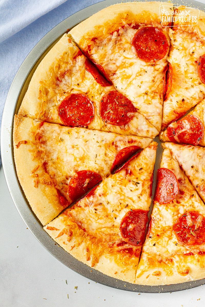 Close up of sliced Homemade pizza with homemade pizza dough.