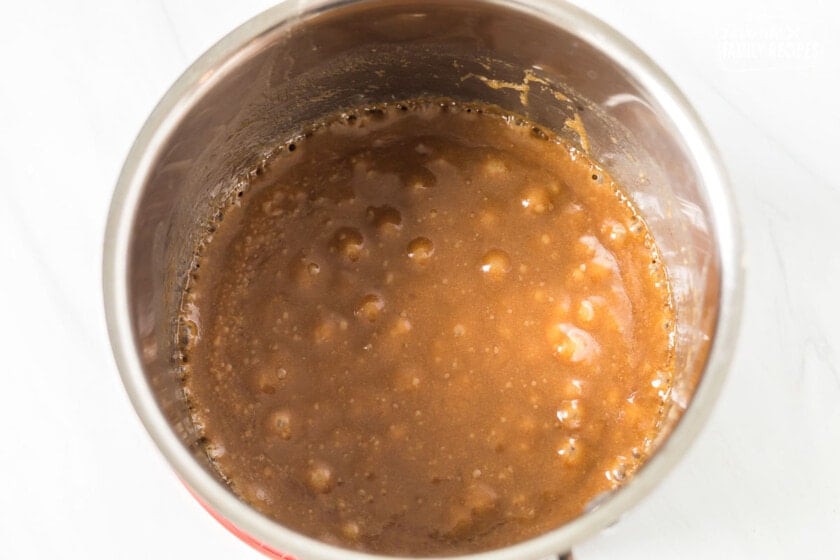 Sticky toffee pudding sauce in a sauce pan