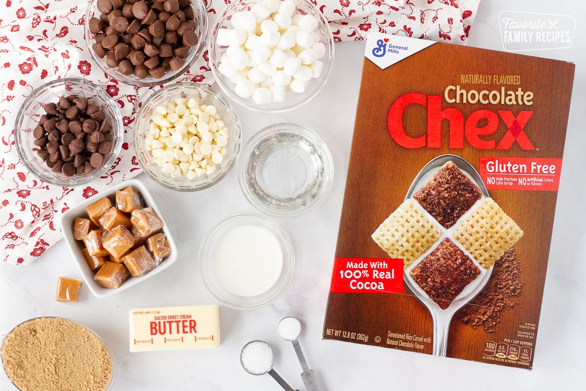 Chocolate Chex, chocolate chips, marshmallows, peanut butter cups, brown sugar, caramels, butter, syrup, cream, salt and baking soda to make Sweet Chex Mix.