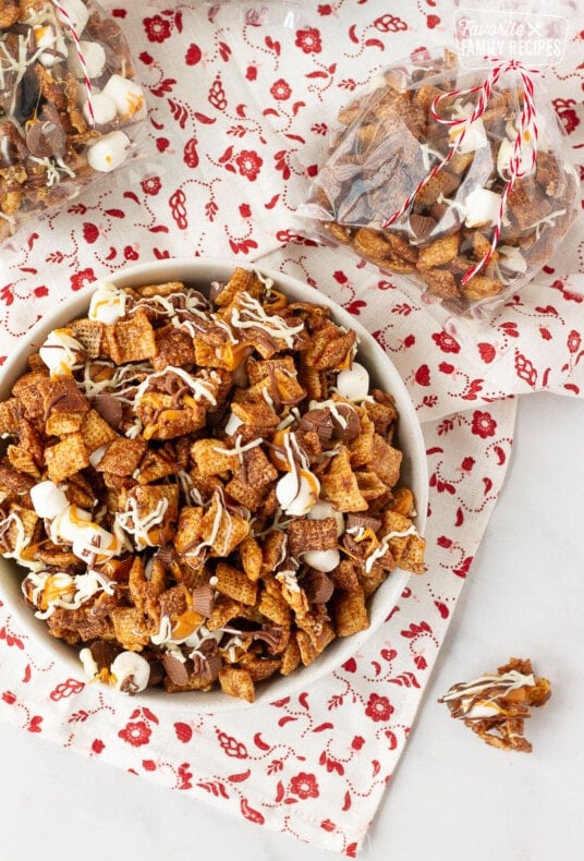 Top view of Sweet Chex Mix in a bowl next to a bag of Sweet Chex Mix.