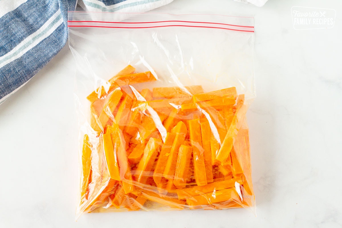 Mixing Sweet Potato Fries in a ziplock bag.