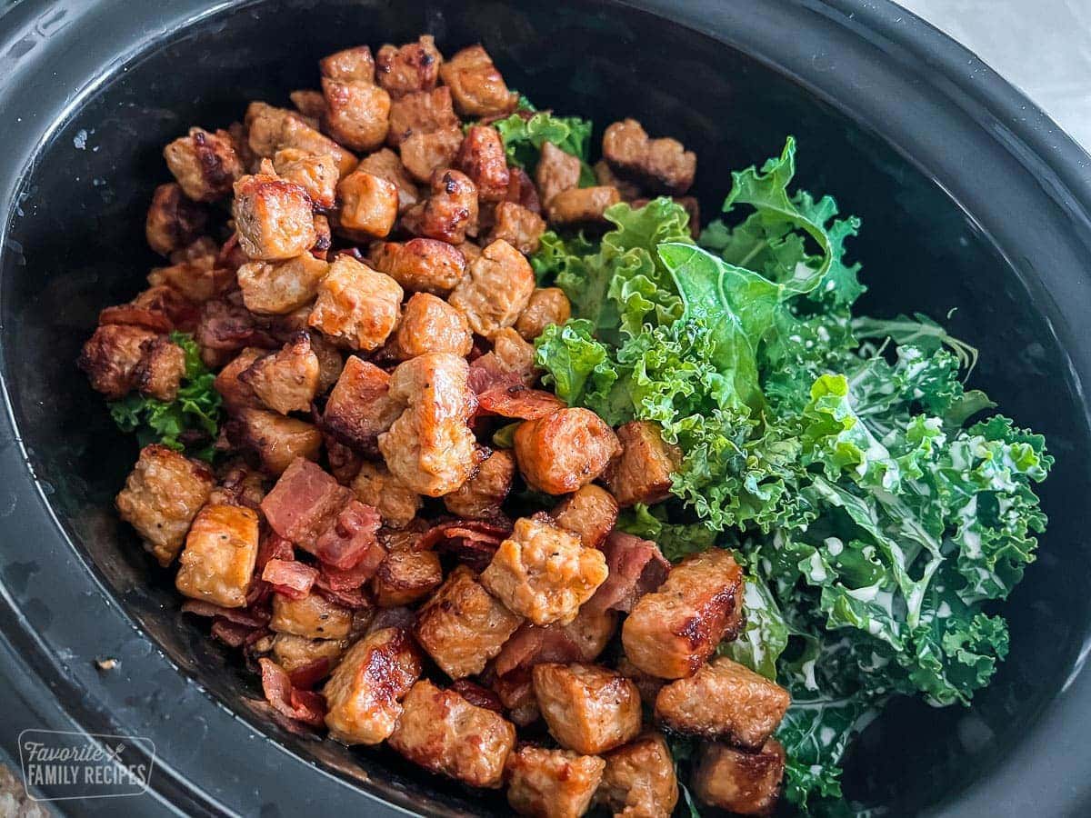 Bacon, sausage, and kale in a Crockpot to make Zuppa Toscana